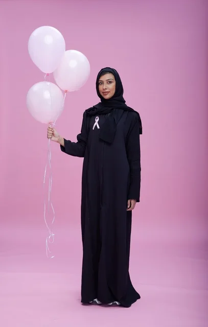 Saudi Woman Supporting Breast Cancer Awareness Pink Background