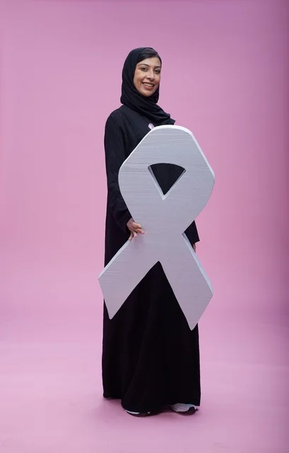 Saudi Woman with Pink Ribbon Awareness Symbol