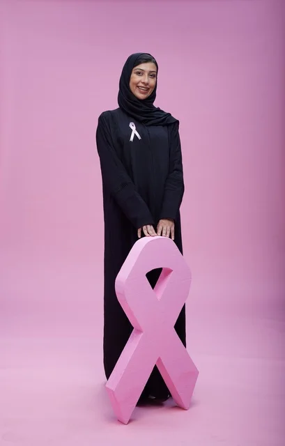 Saudi Woman with Breast Cancer Awareness Pink Ribbon