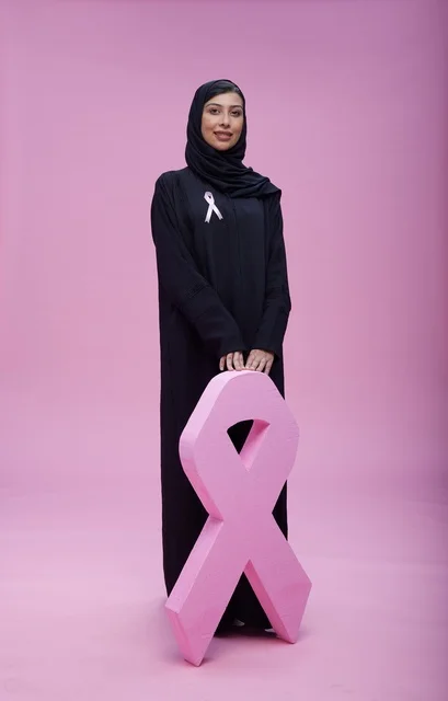 Saudi Woman with Pink Breast Cancer Awareness Ribbon