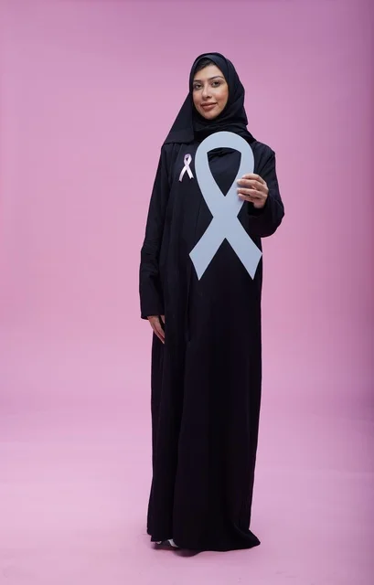 Saudi Woman Holding Breast Cancer Awareness Ribbon