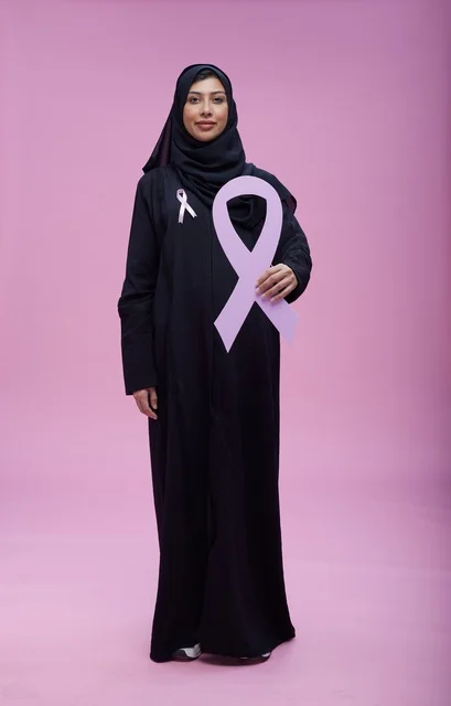 Saudi Woman Holding Pink Breast Cancer Awareness Ribbon