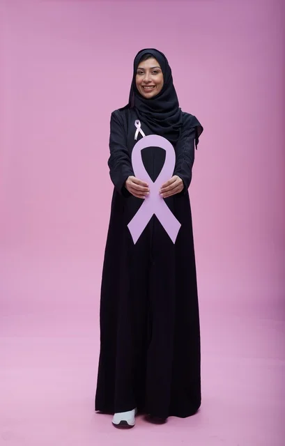 Saudi Woman Holding Pink Breast Cancer Awareness Ribbon