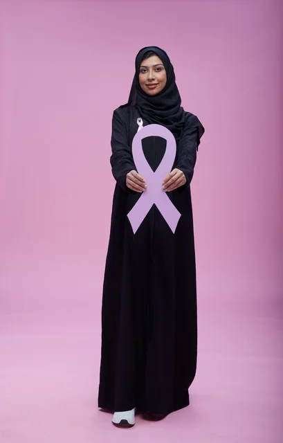 Saudi Woman Holding Breast Cancer Awareness Ribbon