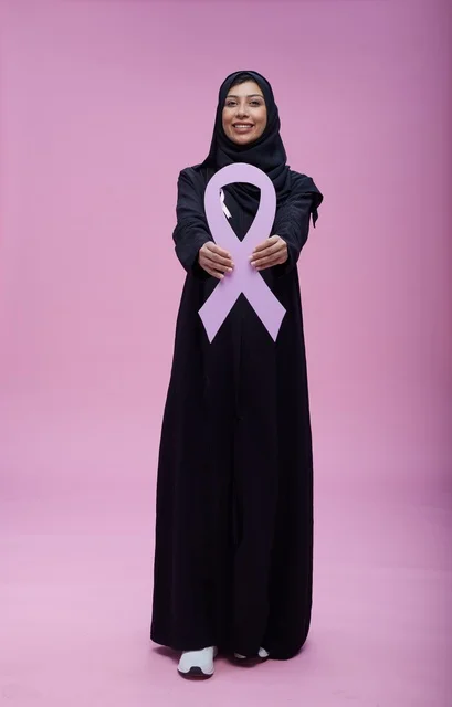 Saudi Woman Holding Pink Breast Cancer Awareness Ribbon