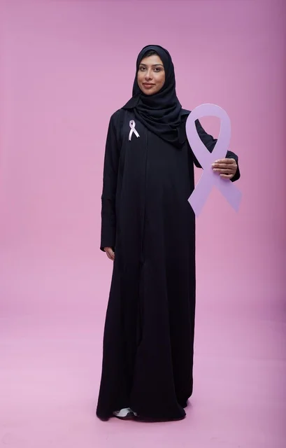 Saudi Woman Holding Breast Cancer Awareness Pink Ribbon