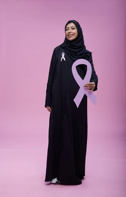 Saudi Woman Holding Breast Cancer Awareness Ribbon