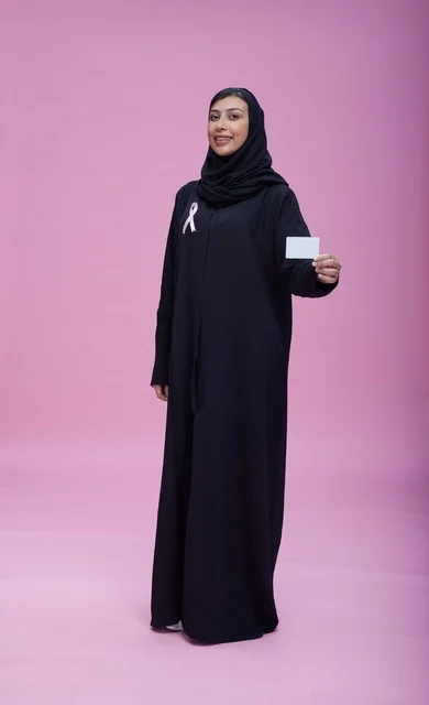 Saudi Woman Holding Breast Cancer Awareness Card