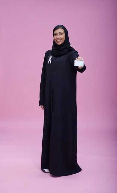 Saudi Woman with Breast Cancer Awareness Ribbon and Card