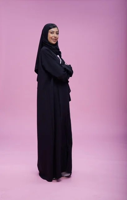 Saudi Woman Standing Against Pink Background Awareness