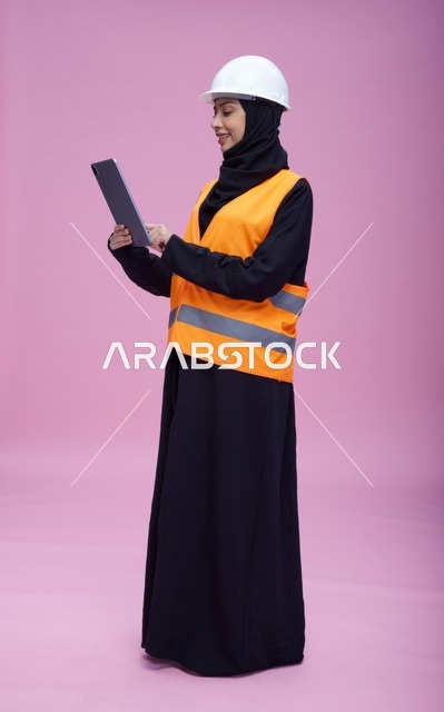 Saudi Female Engineer with Tablet and Safety Gear
