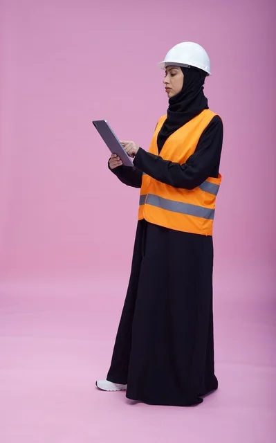 Saudi Female Engineer with Tablet on Pink Background
