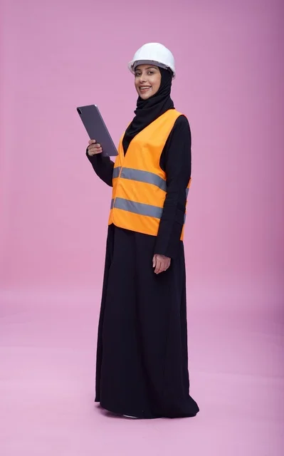 Saudi Female Engineer with Tablet on Pink Background