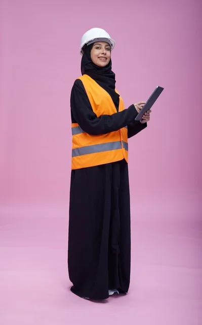 Saudi Female Engineer with Tablet on Pink Background