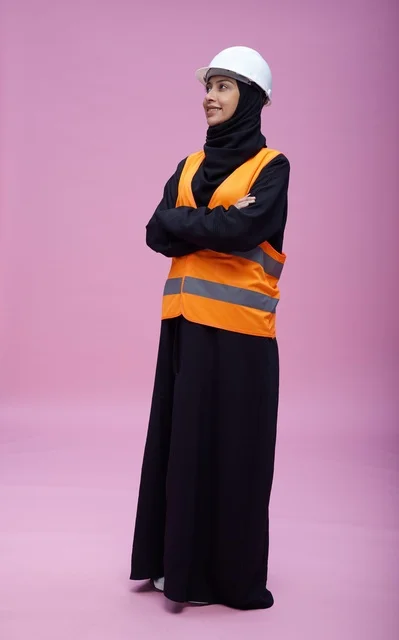Saudi Female Engineer in Safety Gear Pink Background
