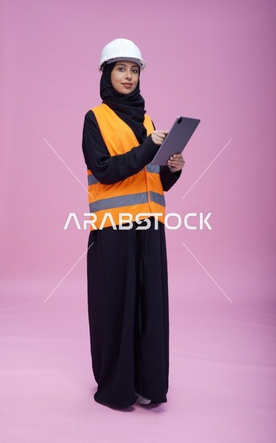 Saudi Female Engineer with Tablet in Safety Gear