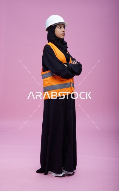 Saudi Female Engineer in Safety Gear on Pink Background