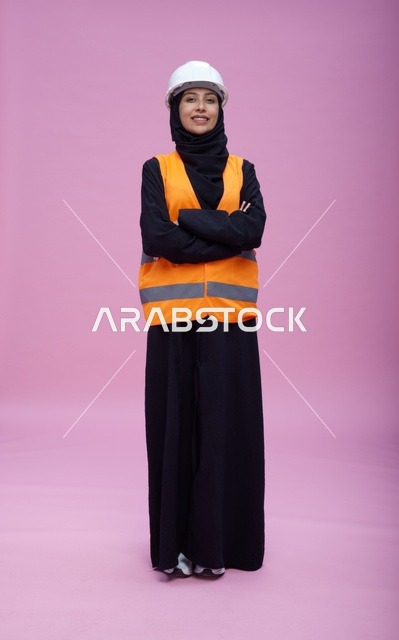 Saudi Female Engineer in Safety Gear Pink Background