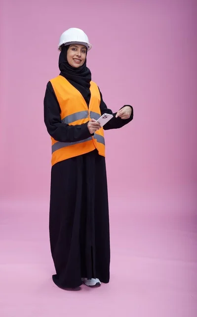 Saudi Female Engineer Pointing at Smartphone