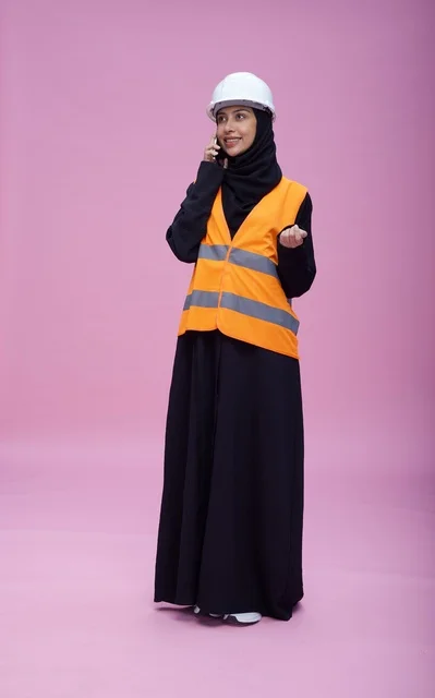 Saudi Female Engineer on Phone in Safety Vest