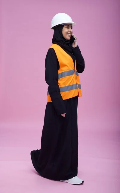Saudi Female Engineer on Phone with Safety Gear
