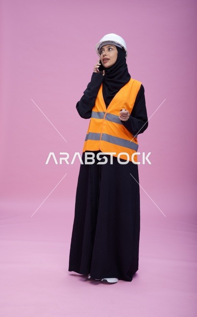 Saudi Female Engineer on Phone with Safety Gear