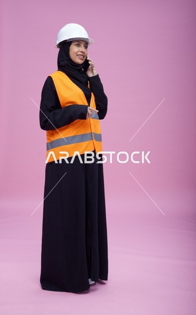 Saudi Female Engineer on Phone in Safety Gear