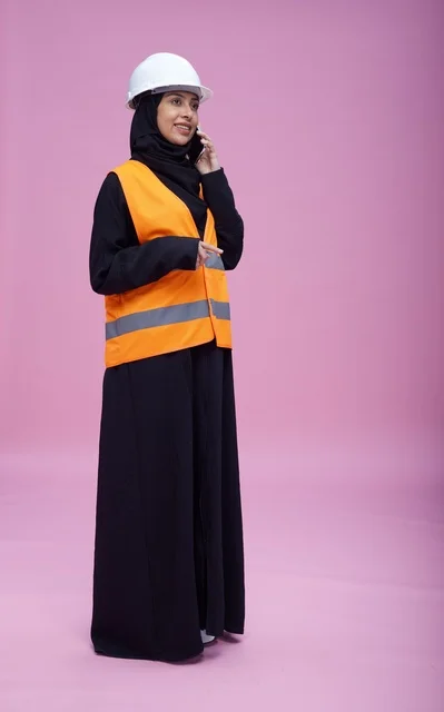 Saudi Female Engineer on Phone in Safety Gear