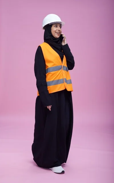 Saudi Female Engineer on Phone with Pink Background