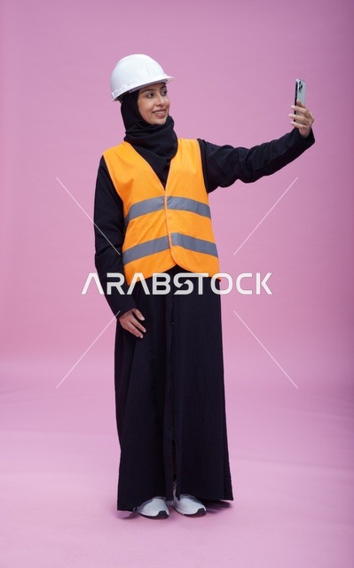 Saudi Female Engineer Taking Selfie on Pink Background