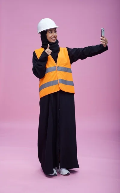 Saudi Female Engineer Taking Selfie on Pink Background