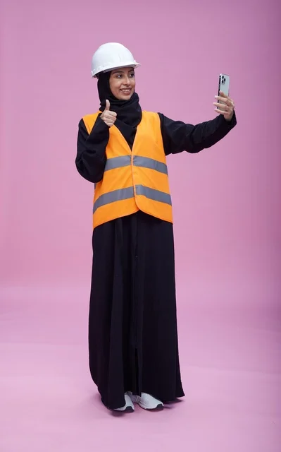 Saudi Female Engineer Taking Selfie on Pink Background