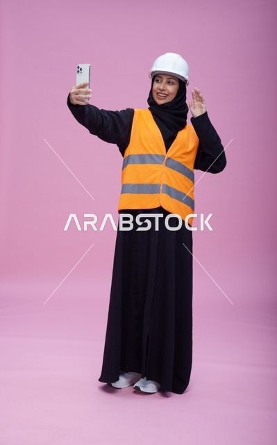 Saudi Female Engineer Taking Selfie on Pink Background