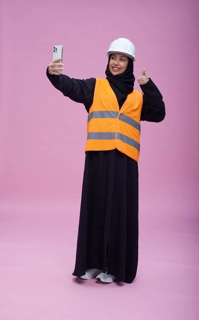 Saudi Female Engineer Taking Selfie with Smartphone