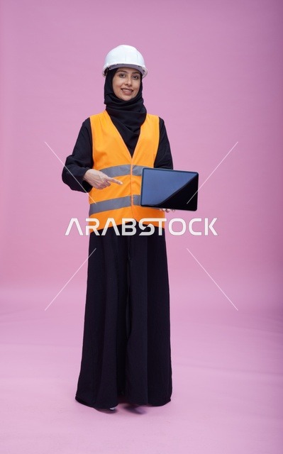 Saudi Female Engineer with Tablet and Safety Gear