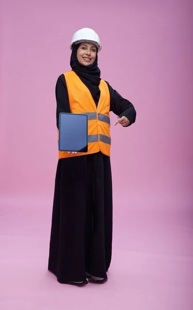 Saudi Female Engineer Holding Tablet on Pink Background