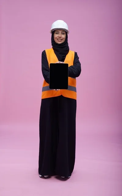 Saudi Female Engineer with Tablet on Pink Background
