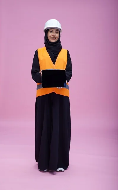 Saudi Female Engineer Holding Tablet on Pink Background