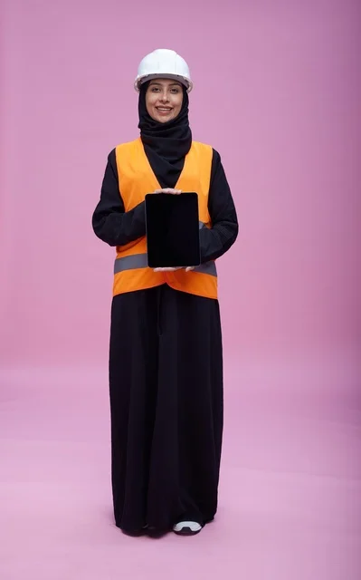 Saudi Female Engineer Holding Tablet on Pink Background