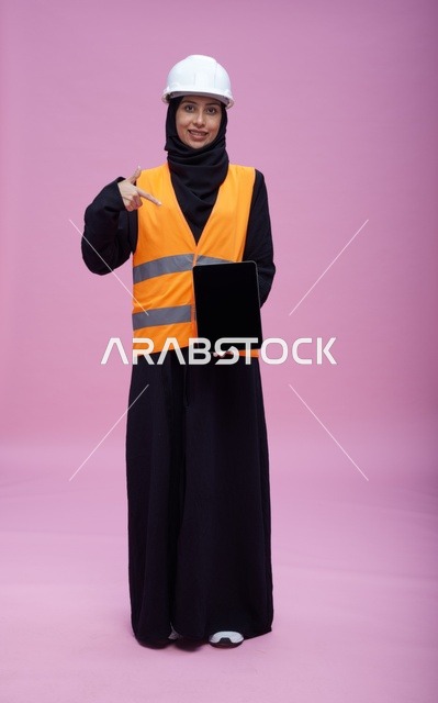 Saudi Female Engineer Holding Tablet in Studio