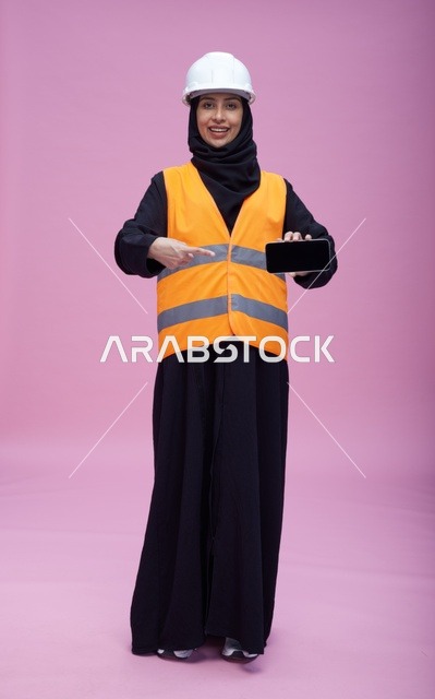 Saudi Female Engineer Holding Smartphone Screen