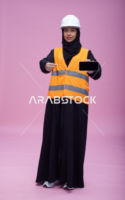 Saudi Female Engineer Holding Smartphone Screen