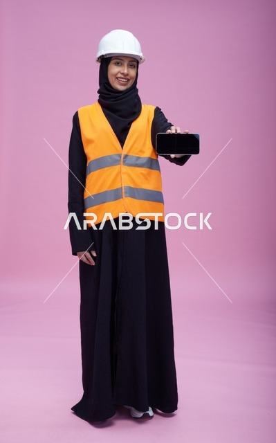 Saudi Female Engineer Holding Smartphone Blank Screen