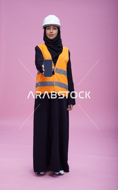Saudi Female Engineer Holding Smartphone Screen