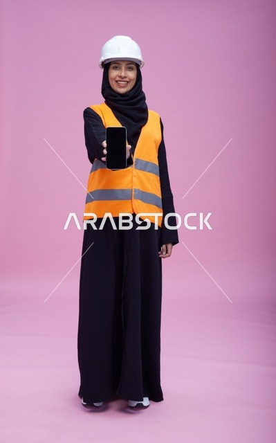 Saudi Female Engineer Holding Smartphone Screen