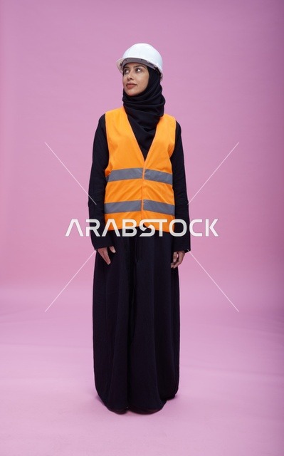 Saudi Female Engineer in Safety Gear Pink Background