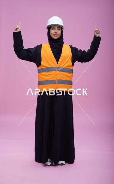 Saudi Female Engineer in Safety Gear on Pink Background