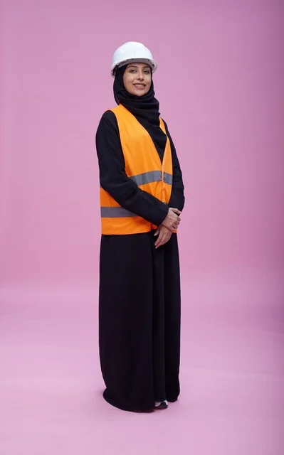 Saudi Female Engineer in Safety Vest on Pink Background