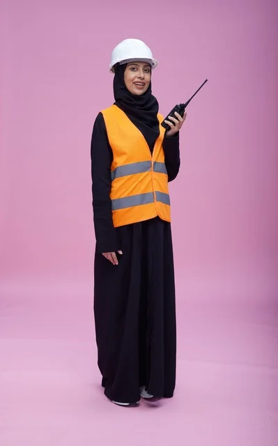 Saudi Female Engineer with Radio in Safety Vest