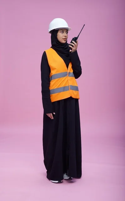 Saudi Female Engineer with Walkie Talkie on Pink